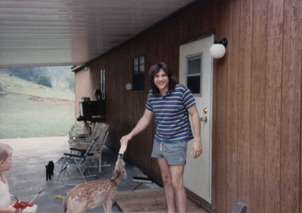 This is a photo of Mike Gallo taken at Frankie Toler's house in the early 90's. Mike was Bass player & Road manager for the GAB. He's feeding Poohey, Frankie's baby deer, so to speak. It was a wild deer, but became Frankie's buddy. 