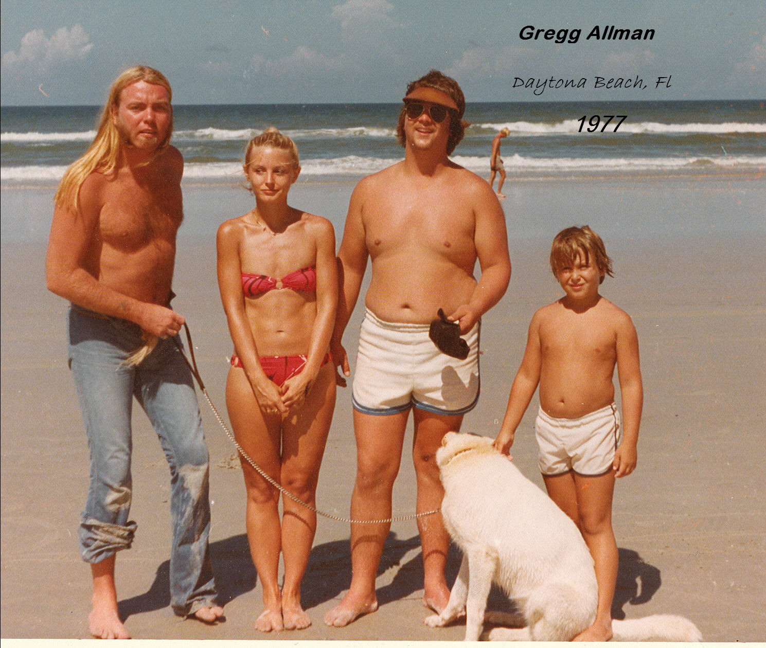 L-R: Gregg Allman, Marsha Stone, Mike Stone, Miss Mac (the dog), Mickey Stone.  This was taken 7/19/77 on Daytona Beach, FL.  Gregg only agreed to be in the picture if we would let him hold the leash for our dog.  He had a solid black German Shepherd at the time.  