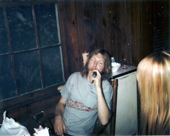 Duane is smoking a cigar after the birth of his daugther.  Pete Carr is credited for the photo.